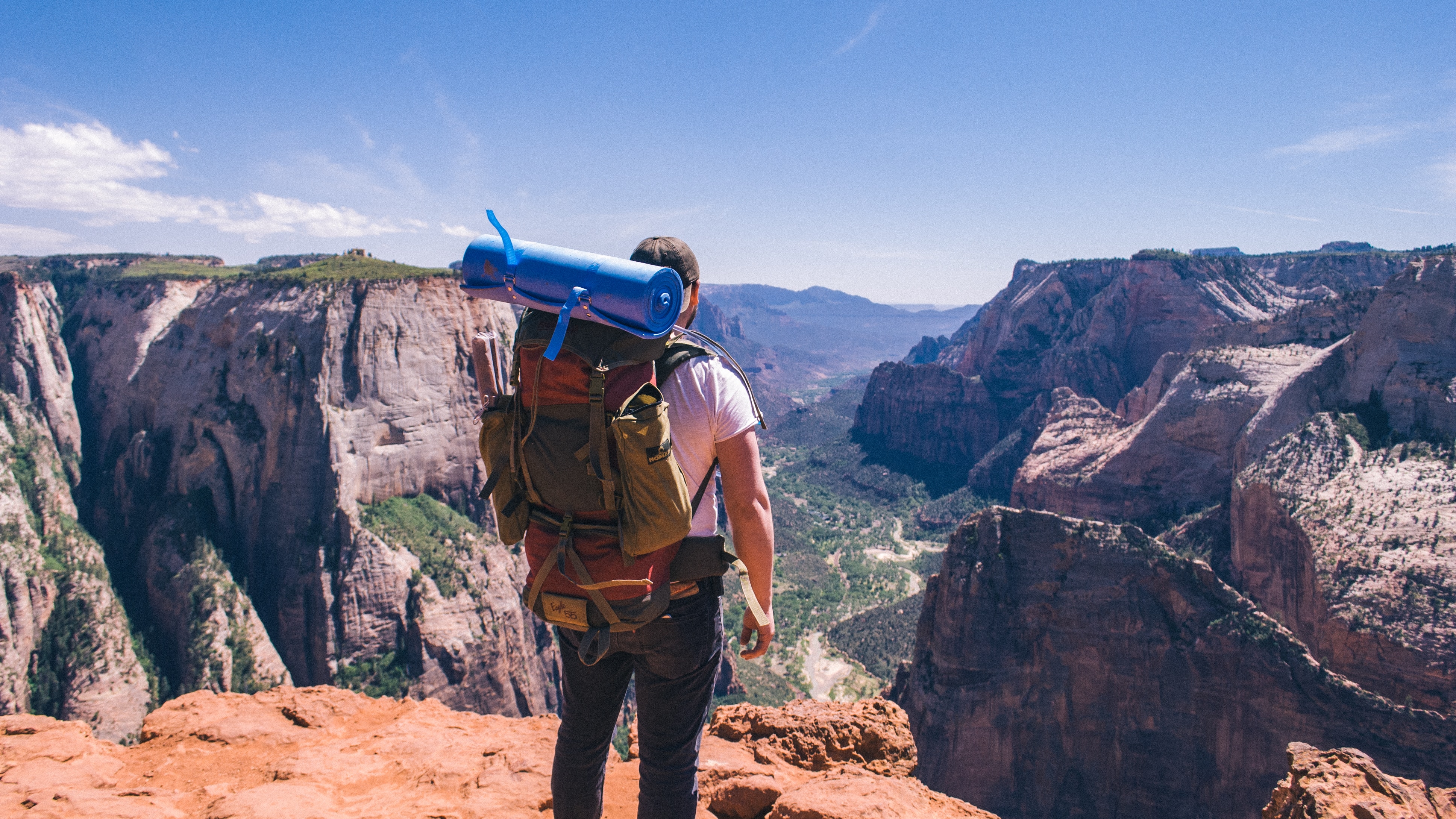 A hiker with a very fully packed backpack.